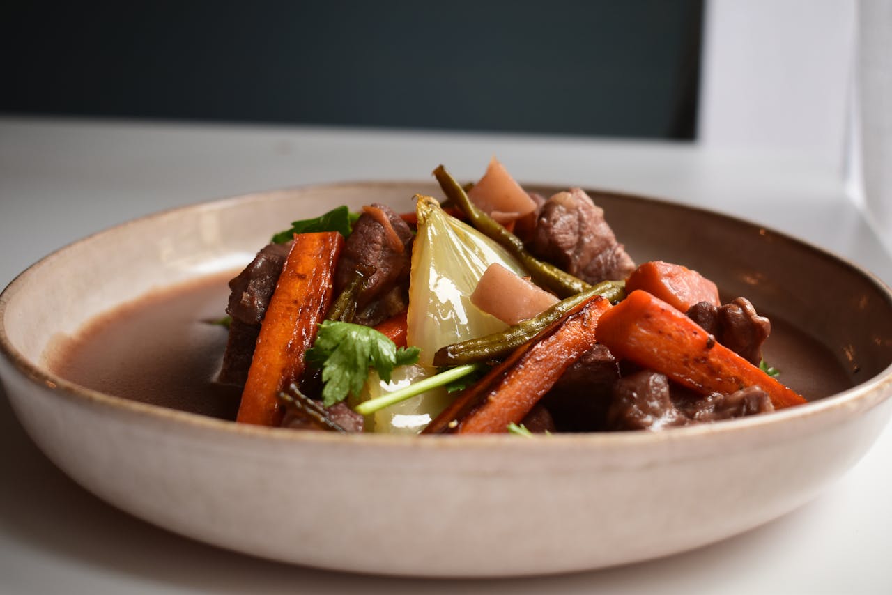 Savor this mouth-watering beef and vegetable stew featuring tender meat and vibrant root vegetables.